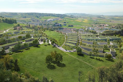 Visualisation du quartier Papillon à Köniz: un lotissement de bâtiments modernes au cœur d’un paysage verdoyant